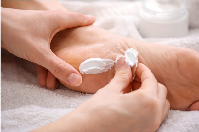 Applying urea cream and medicated corn pads for targeted treatment