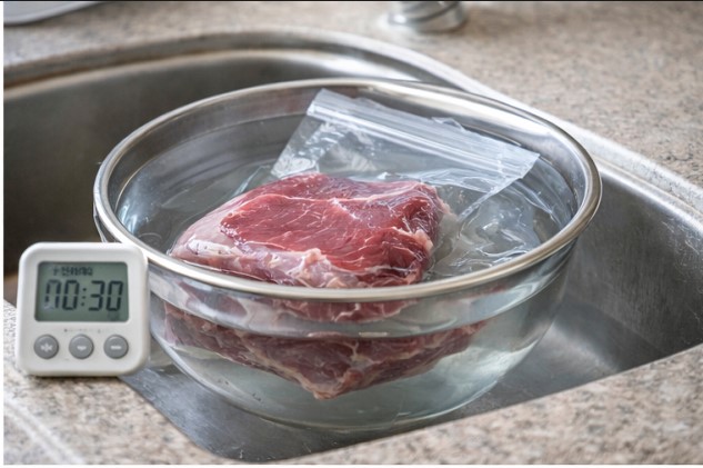 Thawing meat in cold water using a sealed leak-proof bag